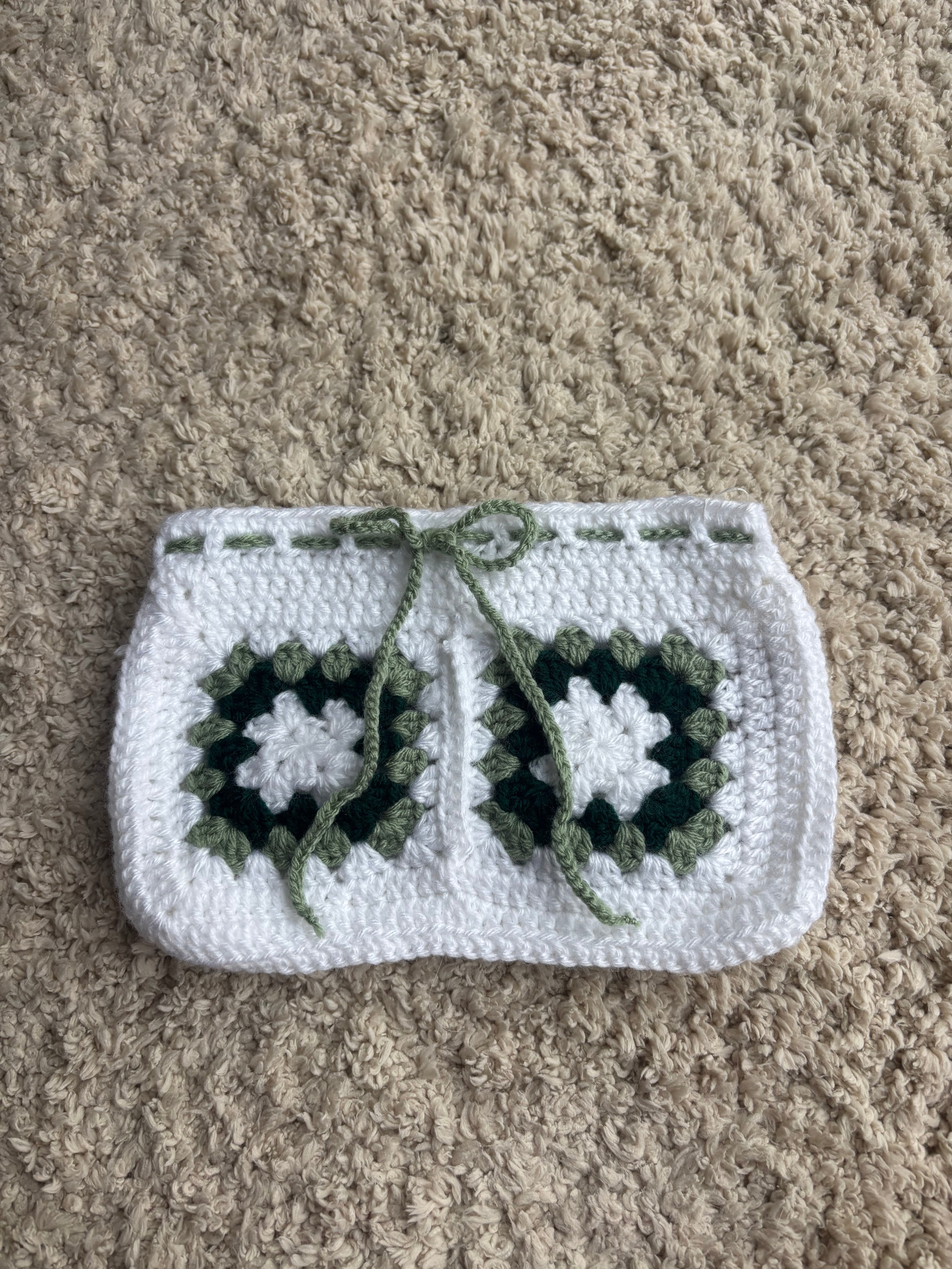 Green and white granny square book sleeve